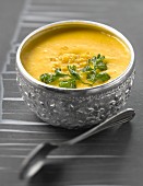 Indian orange lentil soup with fried coriander