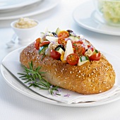 Sesame seed bread stuffed with vegetable and cheese salad