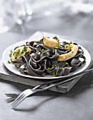 Squid-ink tagliatelles with squid and parsley