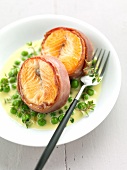 Salmon steaks with raw ham,peas with thyme sauce