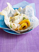 Cod with exotic fruit cooked in wax paper