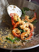 Thai-style shrimps with ginger cooked in a wok
