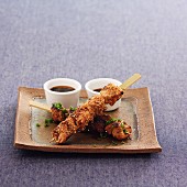 Chicken skewers with sesame seeds, and turkey skewers with chives