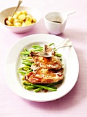 Pork chops with maple syrup and garlic sauce,steam-cooked green beans