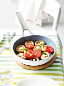 Pan-fried mushrooms with small mozzarella balls,garlic and tomatoes with basil