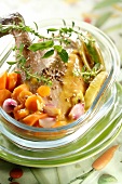 Poulard hen in mustard sauce with herbs and spring vegetables