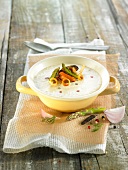 Cream of leek soup with green asparagus and mussels