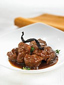 Spanish pork cooked in red wine with vanilla