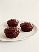 Small chocolate cakes with chocolate icing