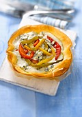 Red,yellow and green pepper and Fourme d'Ambert tartlet