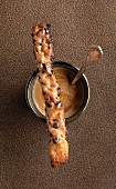 Chocolate chip flaky pastry stick and hot drink