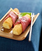 Potato cigares wrapped in thinly sliced veal