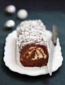 Chocolate and coconut rolled log cake