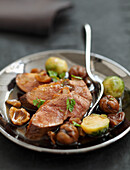 Duck breast with chestnuts and Brussels sprouts