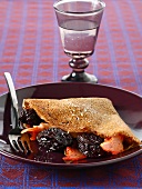 Buckwheat pancake with prunes and bacon
