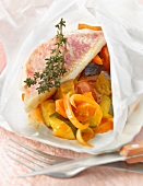 Red mullet and ratatouille cooked in wax paper