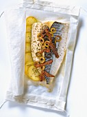 Mackerel with green and black olives,sun-dried tomatoes and zucchinis cooked in wax paper
