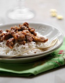 Thinly sliced caramelized turkey breasts with basmati rice