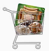 Mini supermarket trolley full of vacuum-packet food