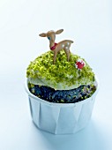 Kid's chocolate cupcake with white chocolate and pistachio cream topping