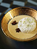 Coconut floating island with star anise-flavored custard