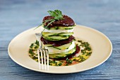 Cucumber, mozzarella and beetroot Mille-feuille with French dressing with herbs