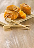Rolled buckwheat crepes with cheddar and smoked ham
