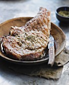 Grilled veal chop with herbs