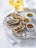 Fresh oysters with three different flavored vinaigrettes