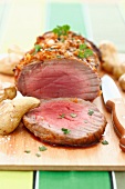 Oven-baked beef fillet with dried apricots and almonds