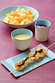 Pear, apple and clementine brochette with two different sauces