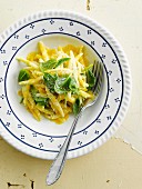 Casarecce with saffron cream and baby spinach shoots