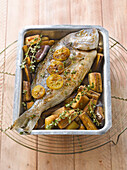 Oven-baked sea bream with confit citrus and eggplants