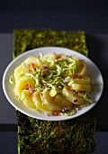 Warm potato salad with thinly sliced Brussels sprouts
