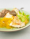 Roasted bass fillet with orange sauce and tapenade