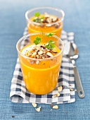 Cream of carrot soup with crushed hazelnuts