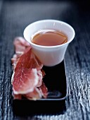 Cup of tea and thin slices of Spanish ham