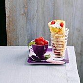 Rolled crepe with whipped cream and raspberries