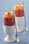 Potatoes stuffed with salmon presented in eggcups