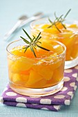 Peaches in jelly with rosemary