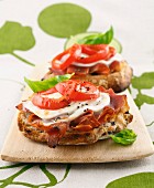 Tomato, mozzarella, Parma ham and basil toasted open sandwich