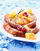 Vanilla-flavored French toast with pineapple and raspberries