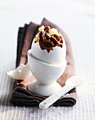 Chocolate,coconut and pineapple dessert served in an eggshell
