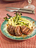 Lamb fillets with turmeric and grilled pak-choi