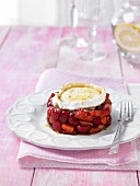 Cherry and strawberry tartare topped with melted goat cheese