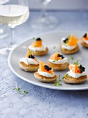 Salmon and fish roe on mini blinis