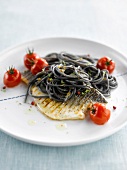Grilled sea bass and squid ink spaghetti
