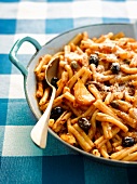Casareccia in tomato sauce with olives,garlic and capers