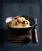 Polenta with smoked salty bacon and mushrooms