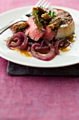 Steak with morels and onions
